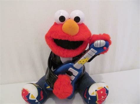 Requires 3 x AA batteries (included). . Rock and roll elmo